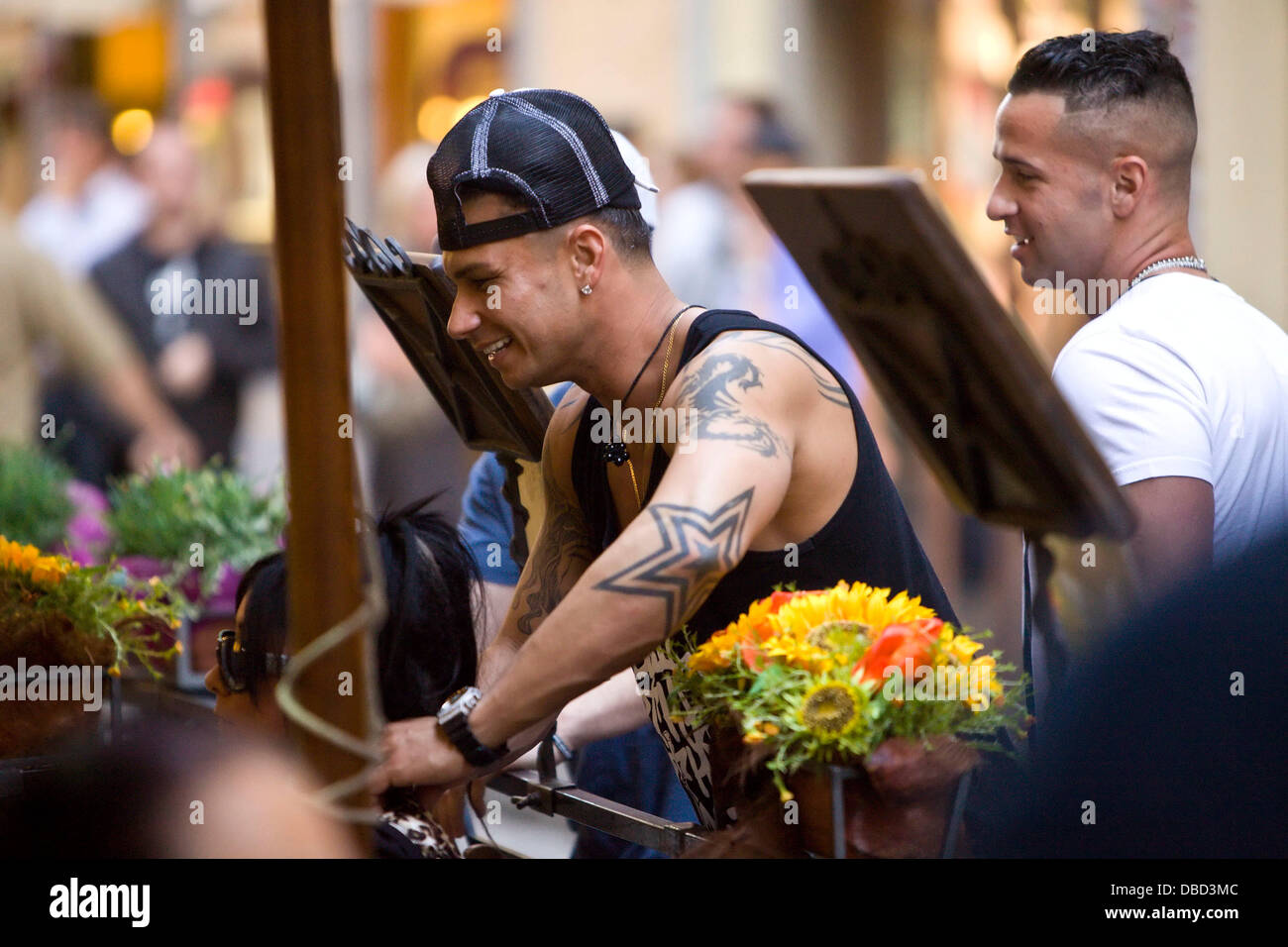 DJ Pauly D, real name Paul DelVecchio and Mike 'The Situation' Sorrentino of 'Jersey Shore' stop by to talk to Snooki and Ronnie who were out having dinner together Florence, Italy - 20.05.11 Stock Photo