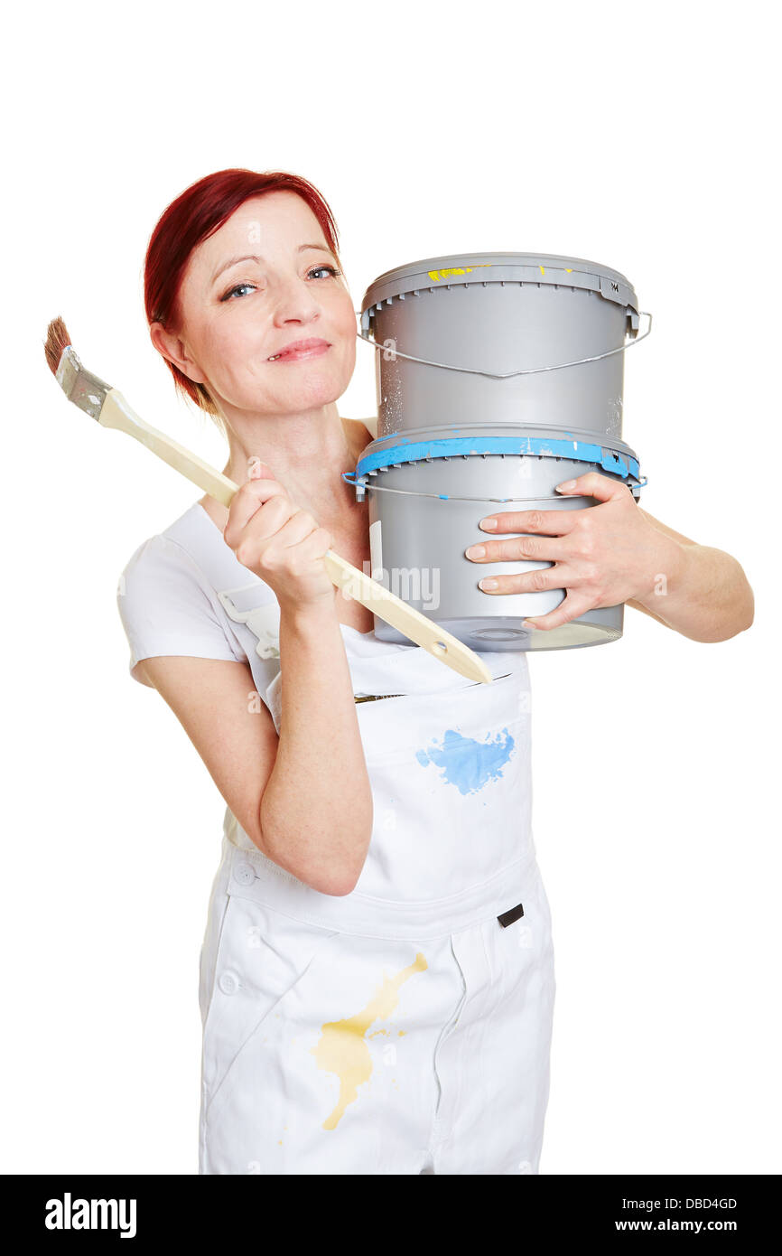 Happy female painter with paintbrush and two paint buckets Stock Photo