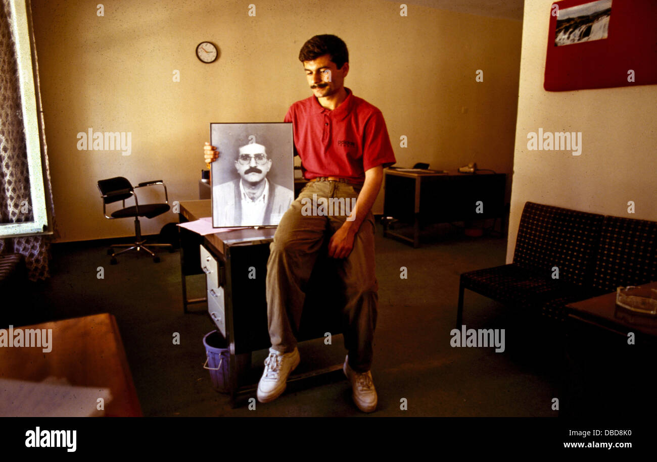 March 1994, Diyarbakir, south-east Turkey. A colleague holds a portrait of murdered Kurdish journalist Hafiz Akdemir. In this period there were many killings of pro-Kurdish Rights journalists by Turkish sponsored assasins. Stock Photo