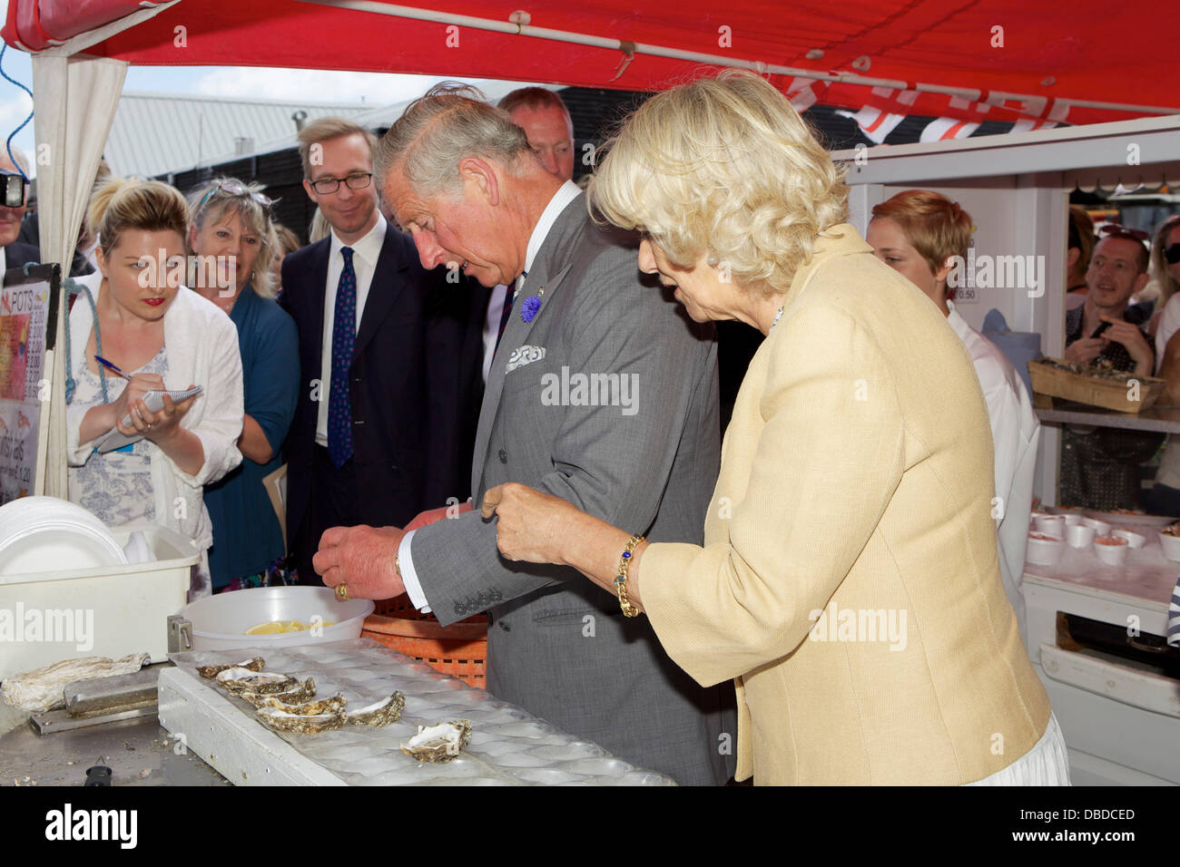 Whitstable Oyster Festival. Kent. Prince Charles eats an Oyster from West Whelks as Camilla, Duchess of Cornwall looks on. Stock Photo