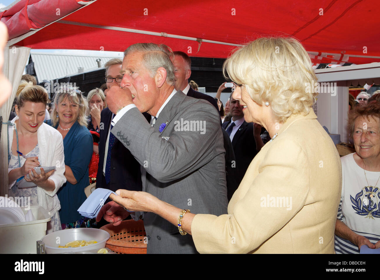 Whitstable Oyster Festival. Kent. Prince Charles eats an Oyster from West Whelks as Camilla, Duchess of Cornwall looks on. Stock Photo