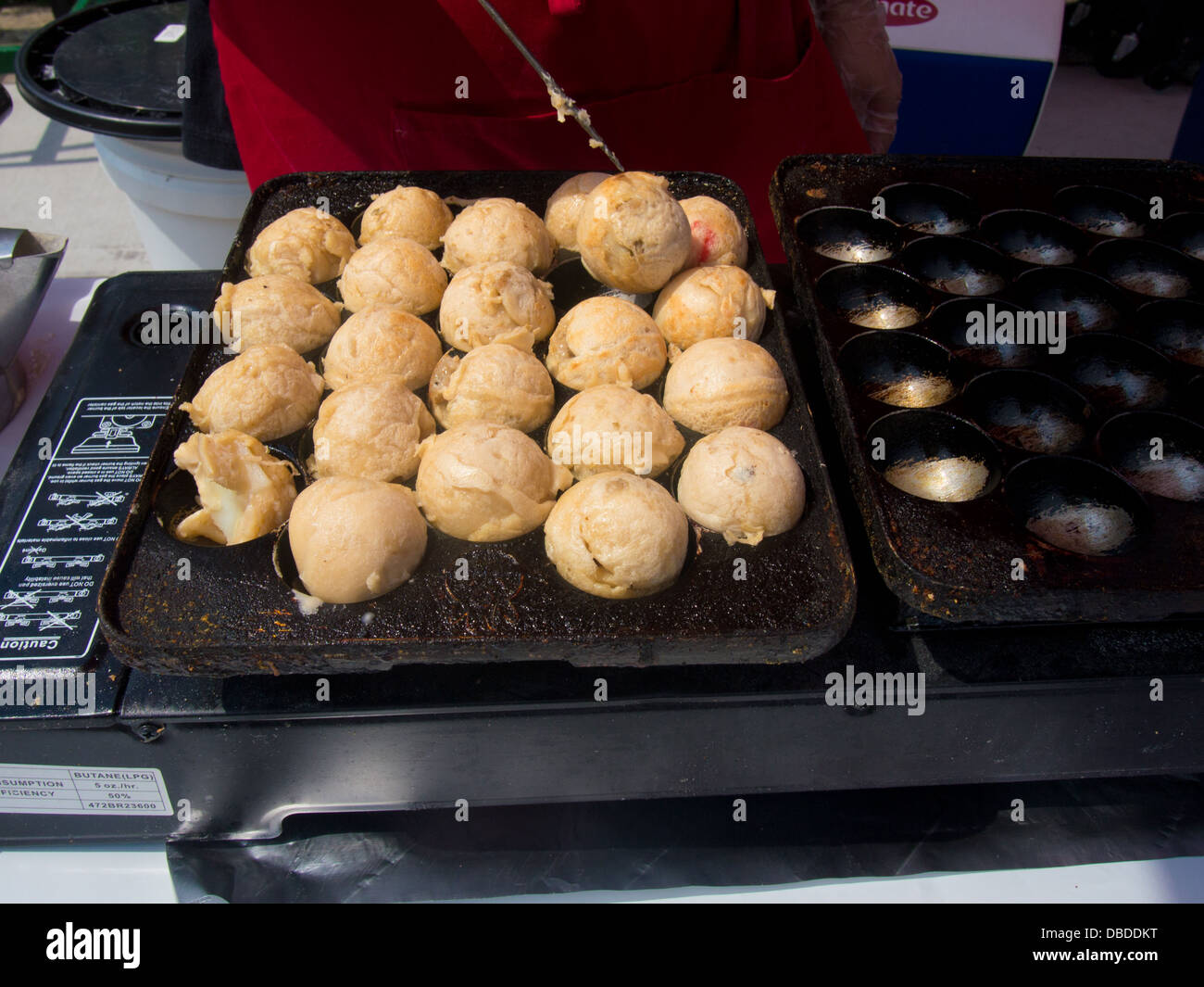 Japanese Takoyaki balls cooking in Takoyaki pan Stock Photo - Alamy