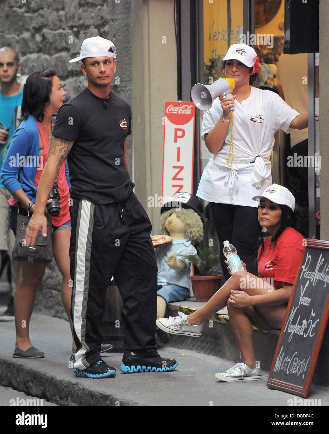 Paul 'Pauly D' DelVecchio, Deena Nicole Cortese and Nicole 'Snookie' Polizzi Attempt to entice people into the pizza shop they are working at for the summer, by using a megaphone! Florence, Italy - 23.05.11 Stock Photo