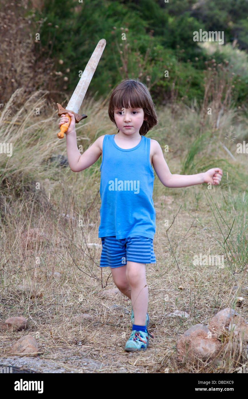 Four year old boy with plastic sword Stock Photo - Alamy