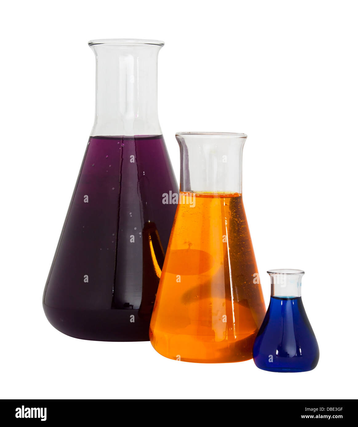Three conical flasks filled with colored solutions isolated against a white background Stock Photo