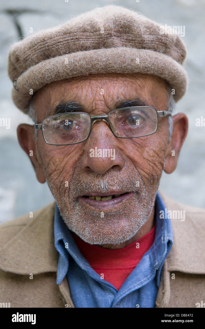 Man wearing traditional Hunza Valley hat, Ganish Village, near Karimabad, Hunza Valley, Gilgit-Baltistan, Pakistan Stock Photo