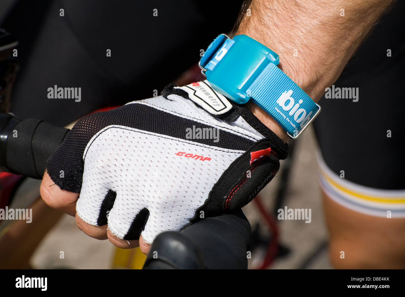 An Activity Monitor being worn on the wrist of person carrying out an activity & taking part in research conducted by UK Biobank Stock Photo