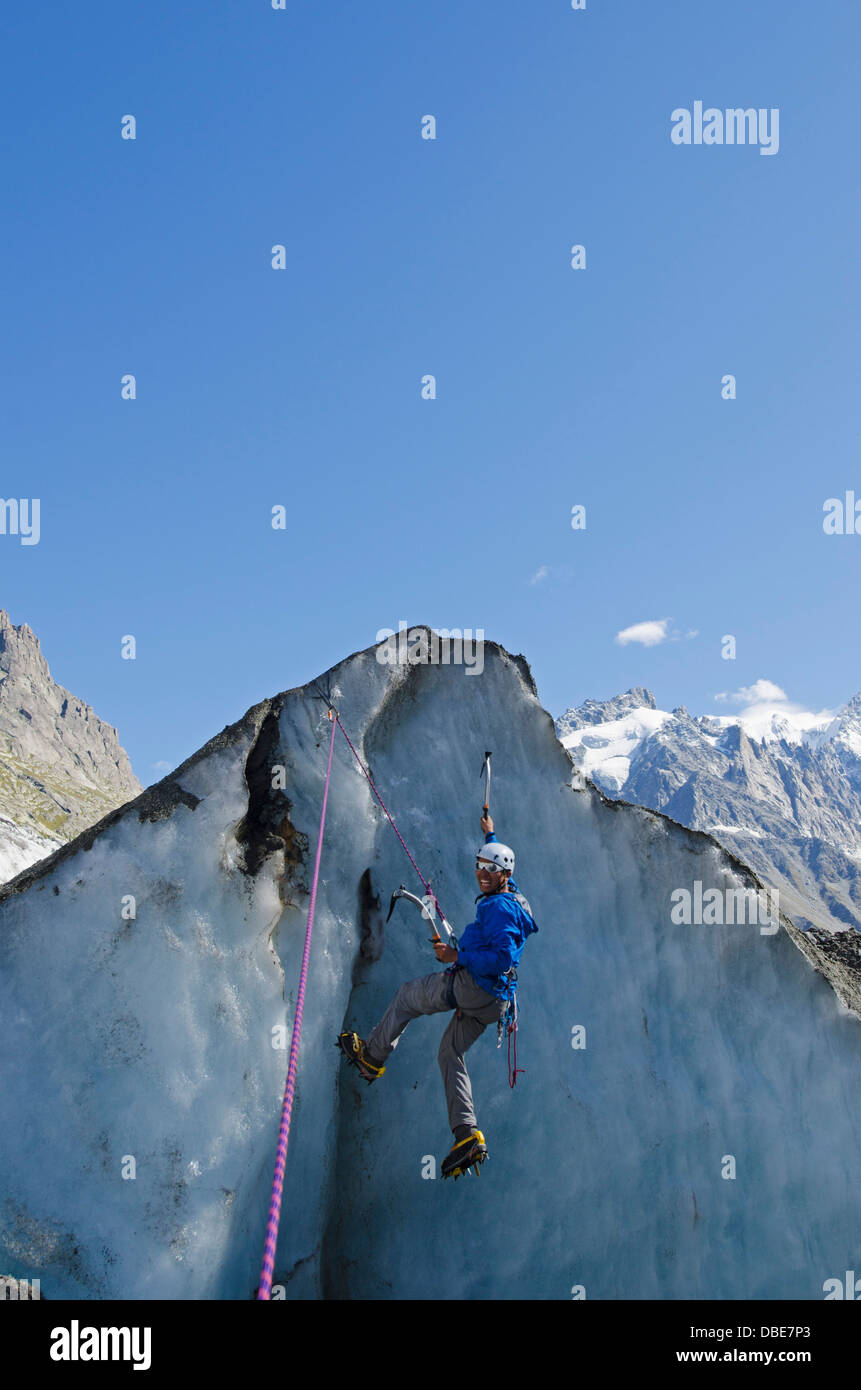 Europe, France, French Alps, Haute-Savoie, Chamonix, climber at Mer de Glace glacier (MR) Stock Photo