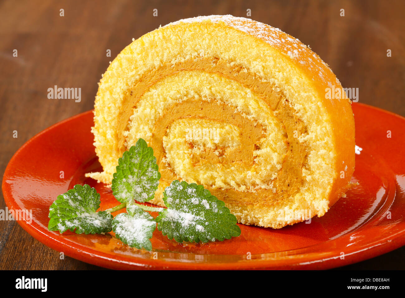Swiss roll with peanut butter cream filling Stock Photo