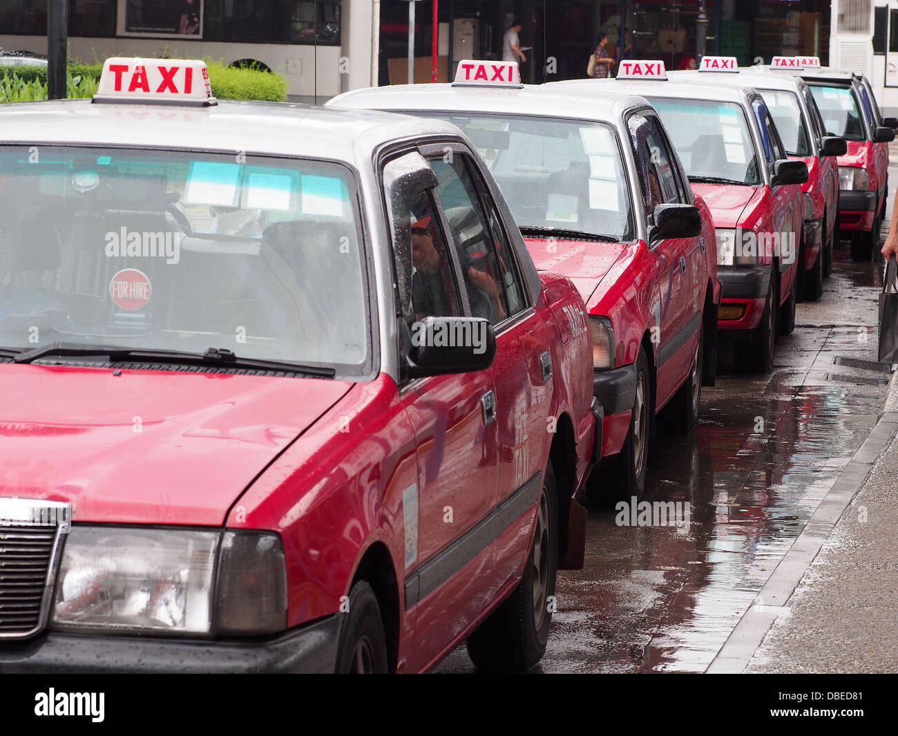 Line of Hong Kong taxis queuing Stock Photo