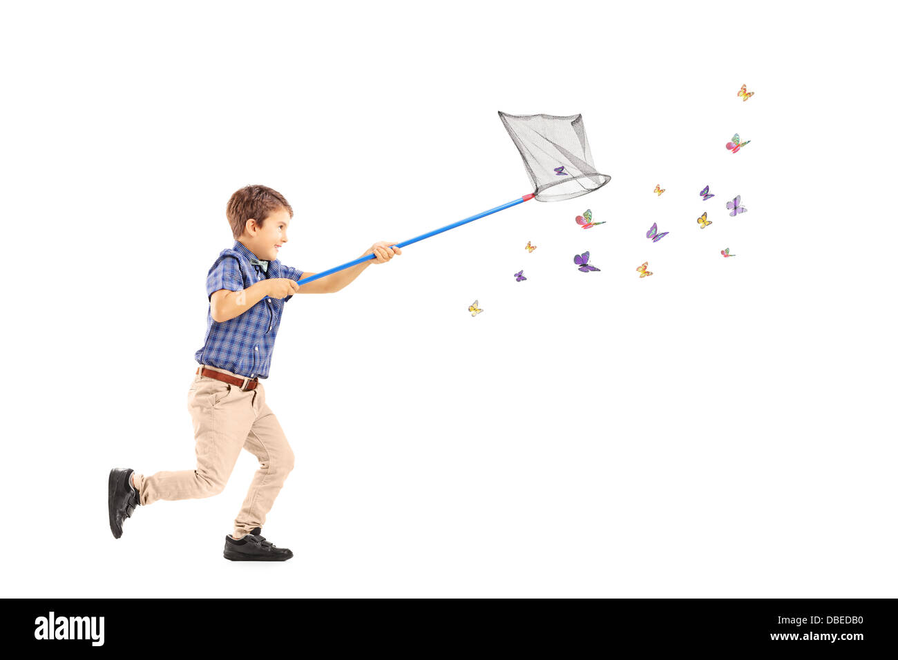 Full length portrait of a kid running and catching butterflies with net Stock Photo
