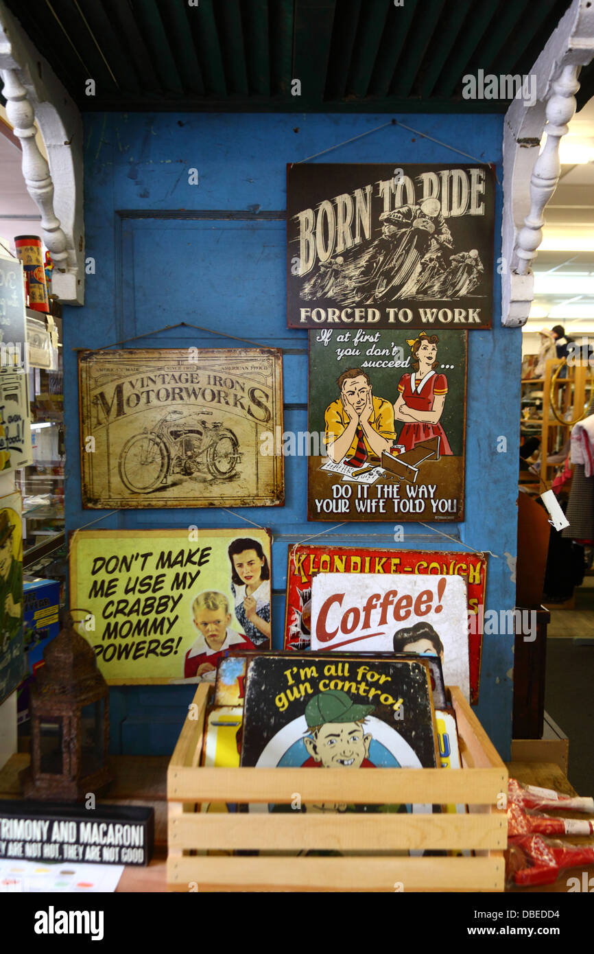 Old fashioned metal advertising signs for sale in antique shop, Oakland, Maryland, United States of America Stock Photo