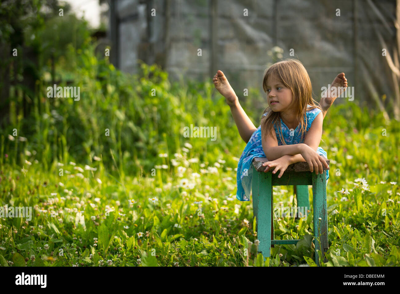 Portrait of little girl in the yard of a country house Stock Photo - Alamy