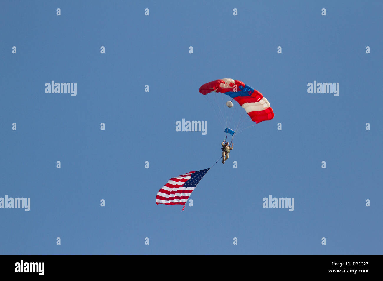 Skydiver with parachute and American flag. Stock Photo