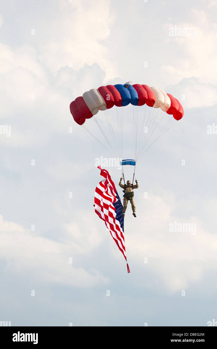 Skydiver with parachute and American flag. Stock Photo