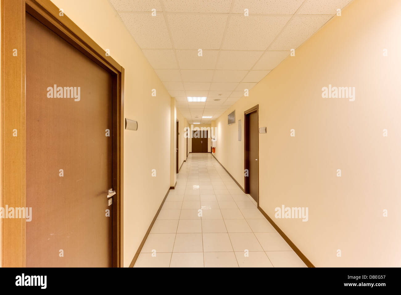 empty long corridor in the modern office building Stock Photo