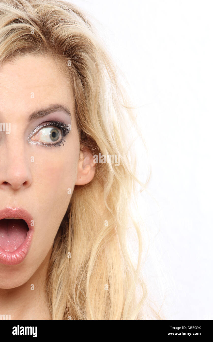 Blonde woman looking sideways close-up surprised Stock Photo