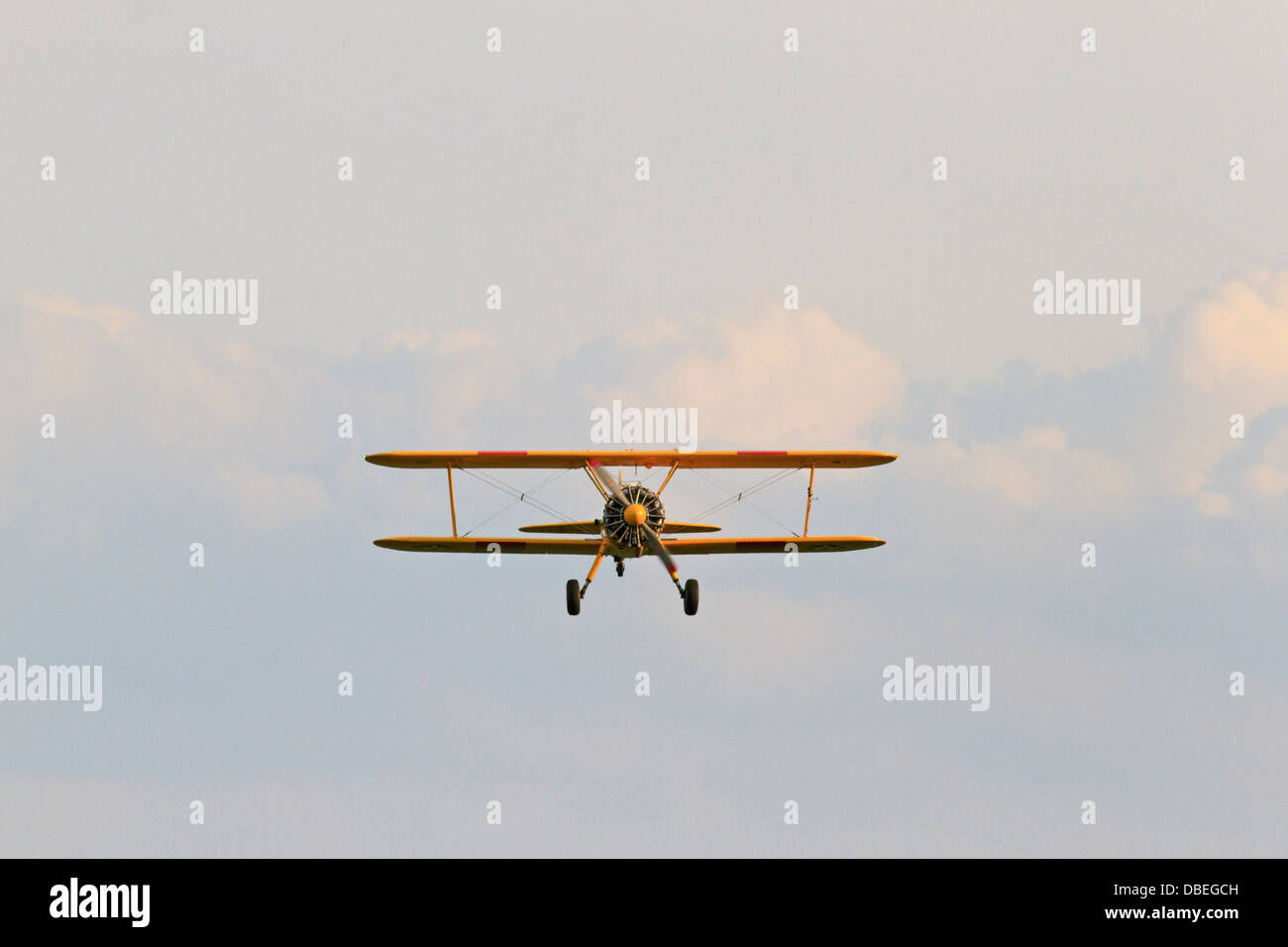 Boeing N2S Stearman (PT-17) in flight (old world war 2 trainer aircraft). Stock Photo
