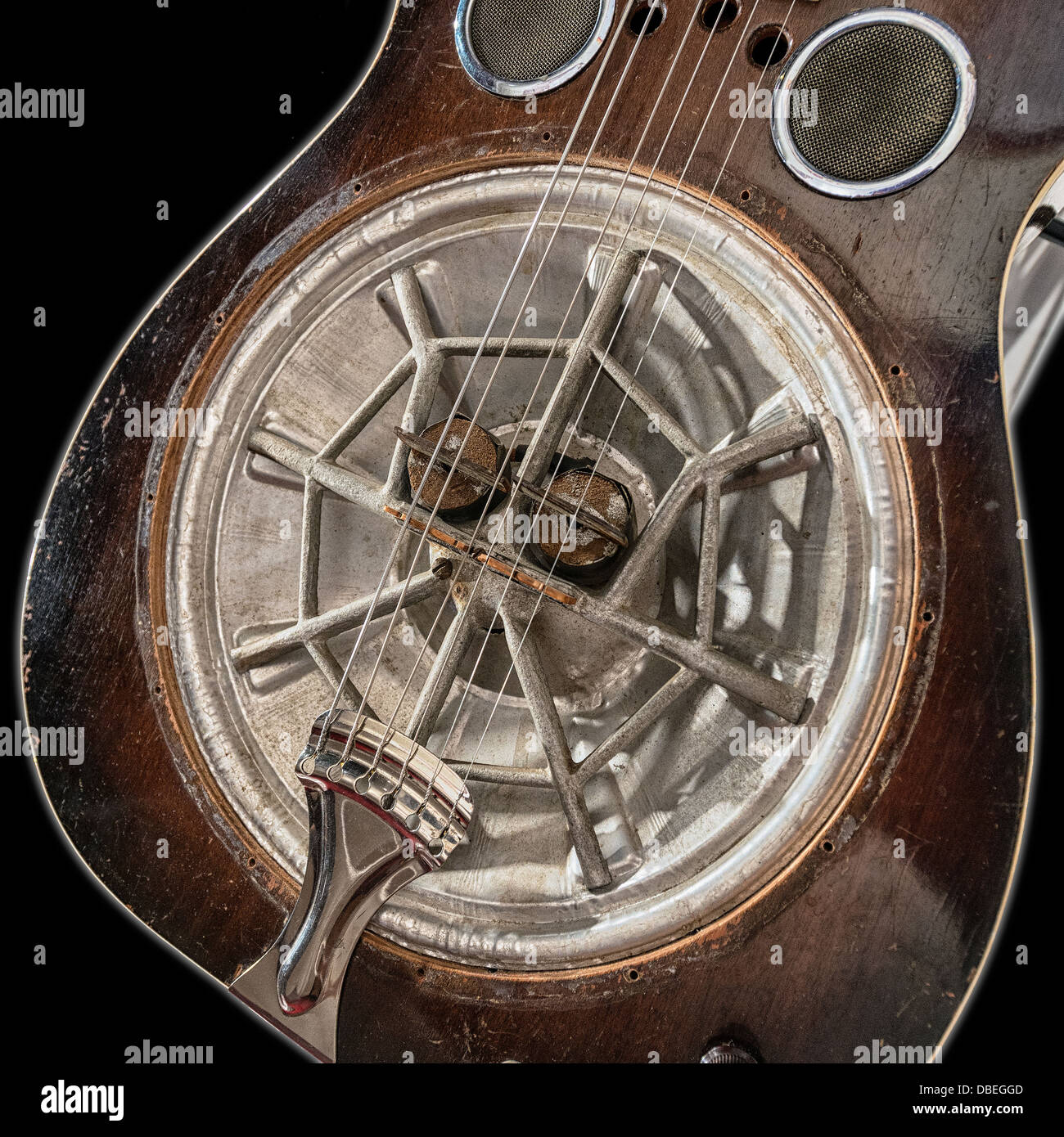 Dobro made some of the first and most popular resonator guitars.  this is image is of the resonator of a Dobro guitar Stock Photo