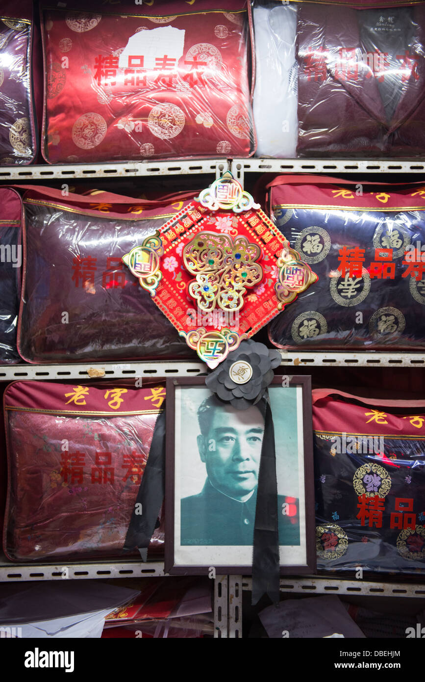Portrait of Zhou EnLai between traditional graveclothes to be used during a funeral ceremony. Stock Photo