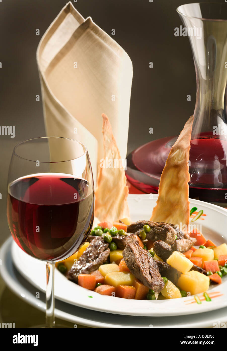 Still life with a glass of white wine and gourmet dinner Stock Photo ...