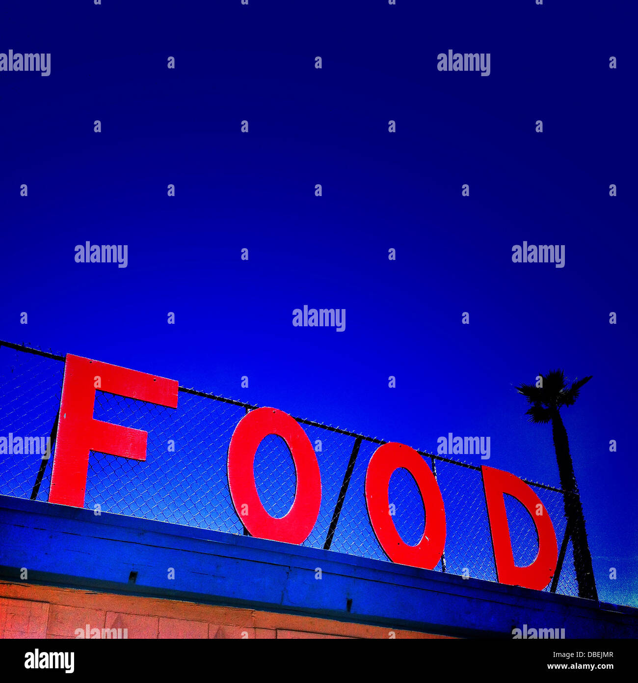 'Food' sign against blue sky Stock Photo