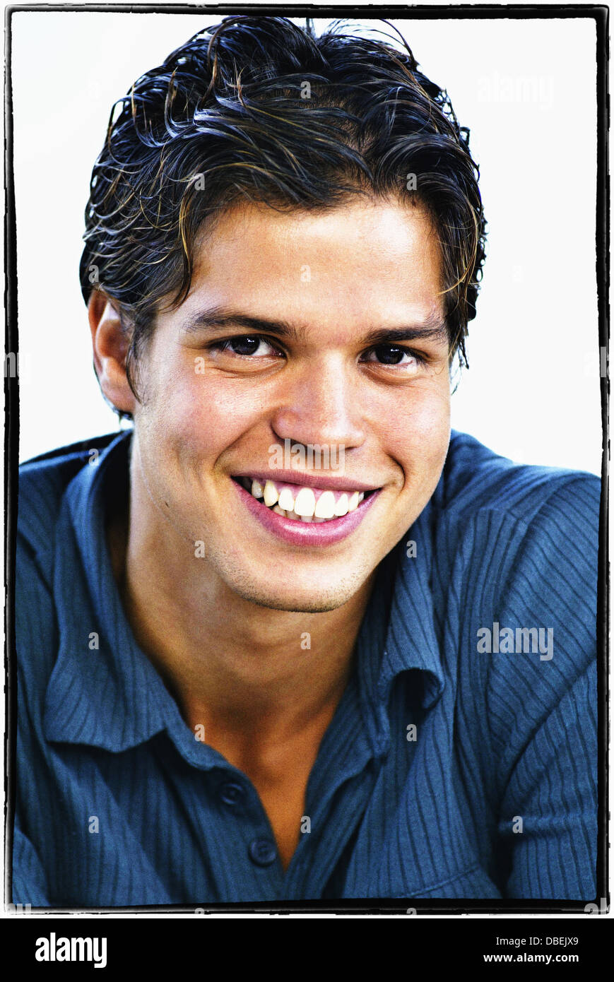 Hispanic man smiling - Smartphone Captured Stock Image