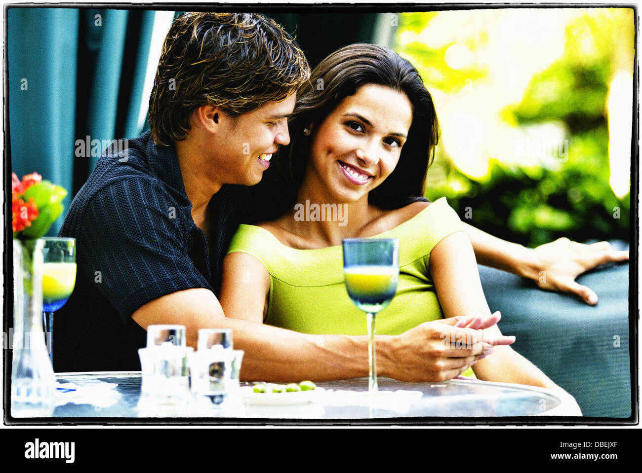 Hispanic couple having lunch together - Smartphone Captured Stock Image