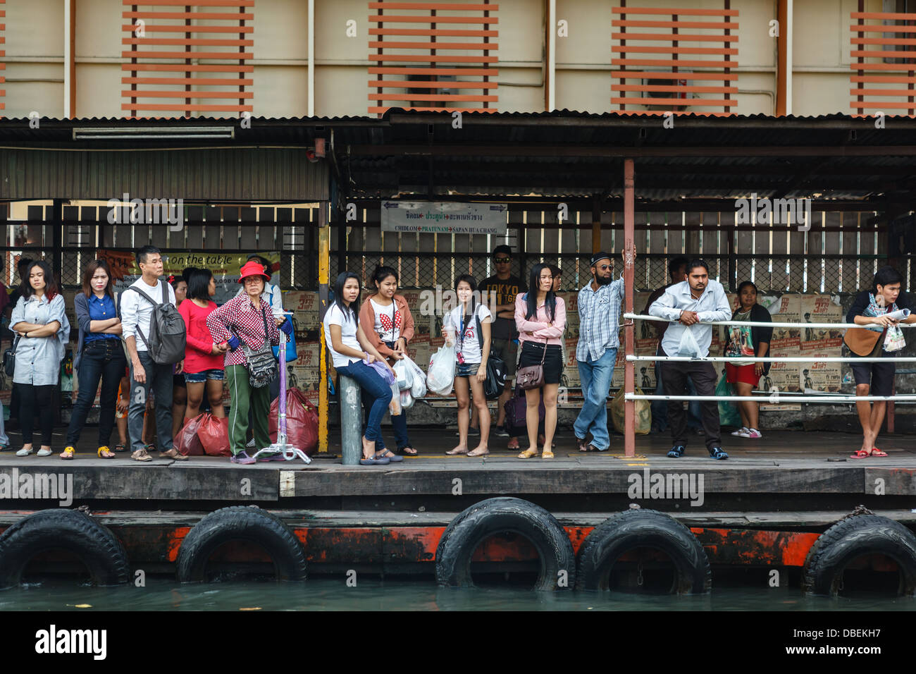 Locals are waiting for a long-boat in Bangkok Stock Photo