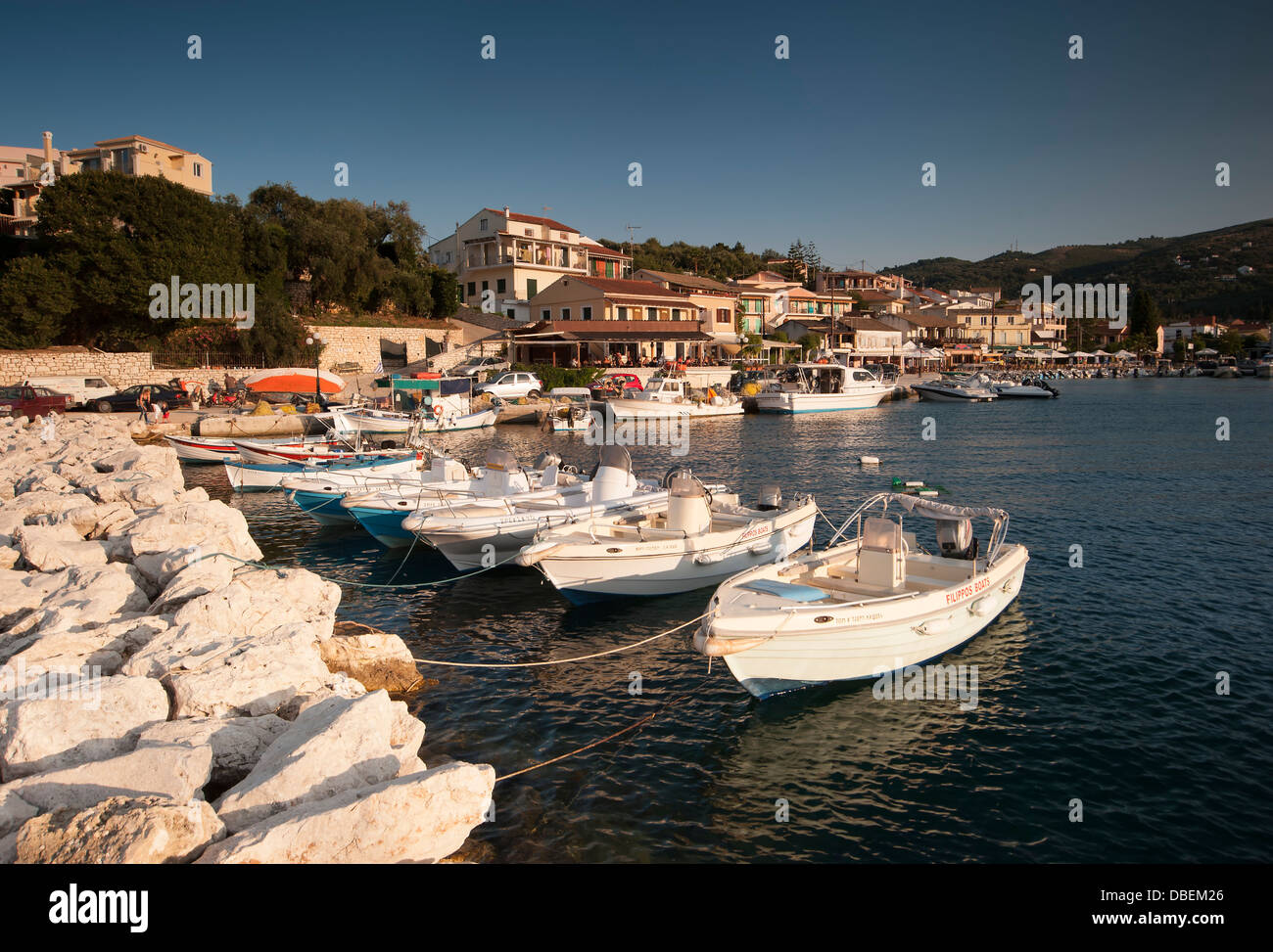 Boats moored at Kassiopi harbour in Corfu, Greece Stock Photo