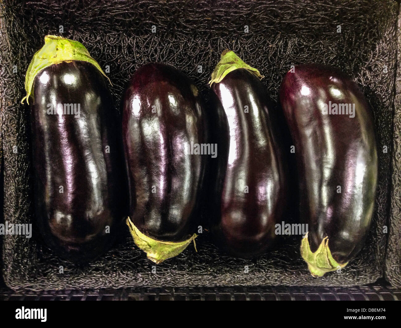 Close up of basket of eggplants - Smartphone Captured Stock Image