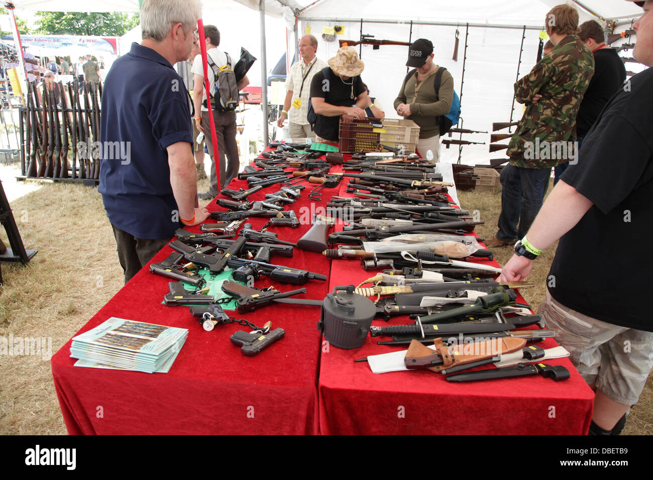People looking at guns at a Military and Arms Fair Stock Photo