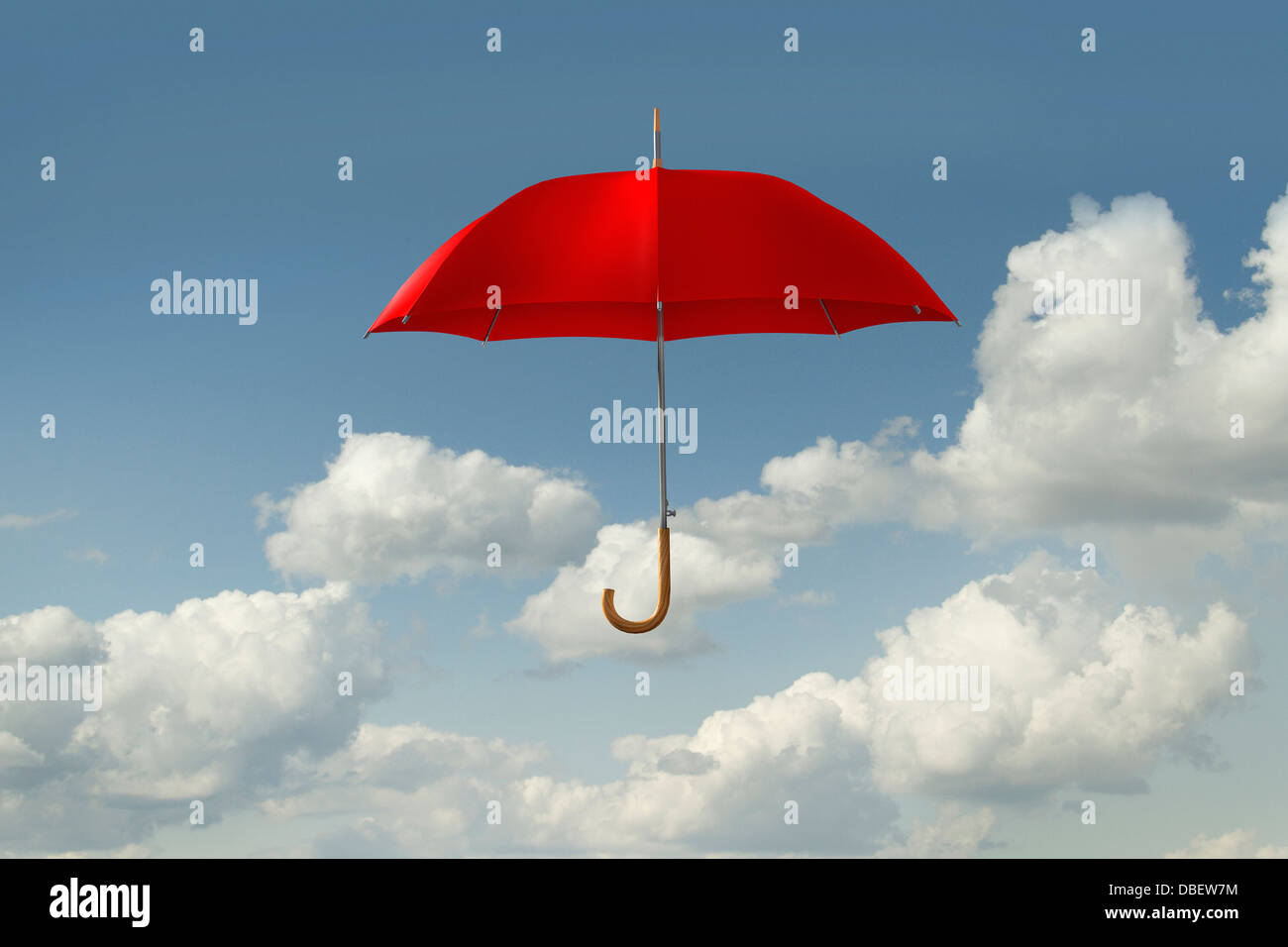 Red umbrella floating in clouds Stock Photo