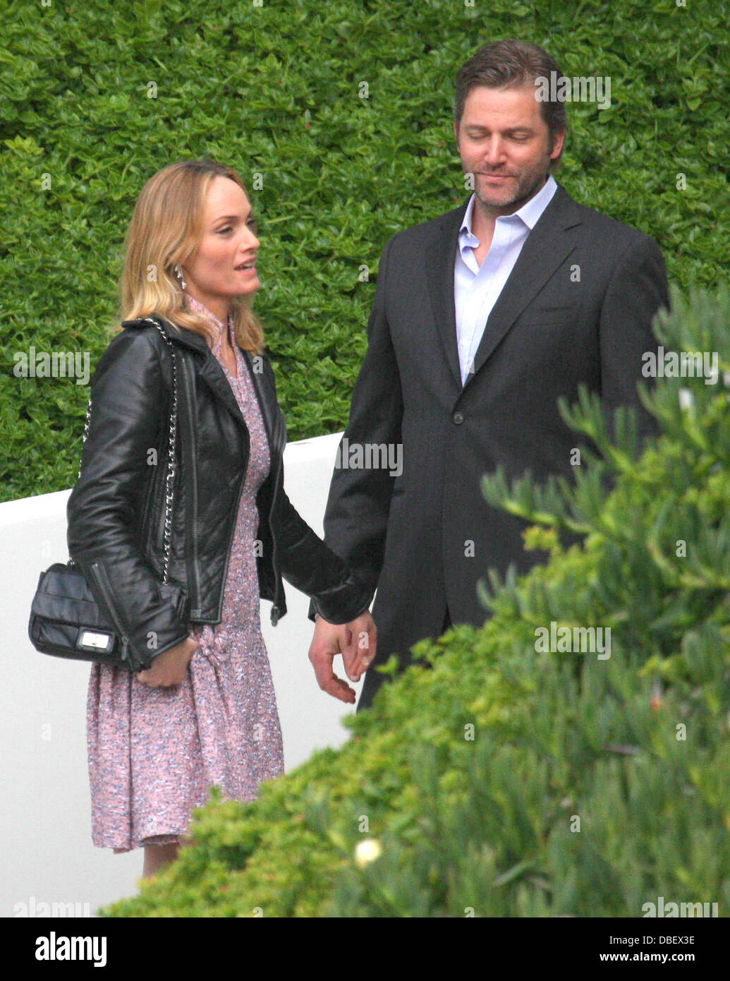 Amber Valletta and Chip McCaw, arrives at Chanel Hosts Benefit Dinner