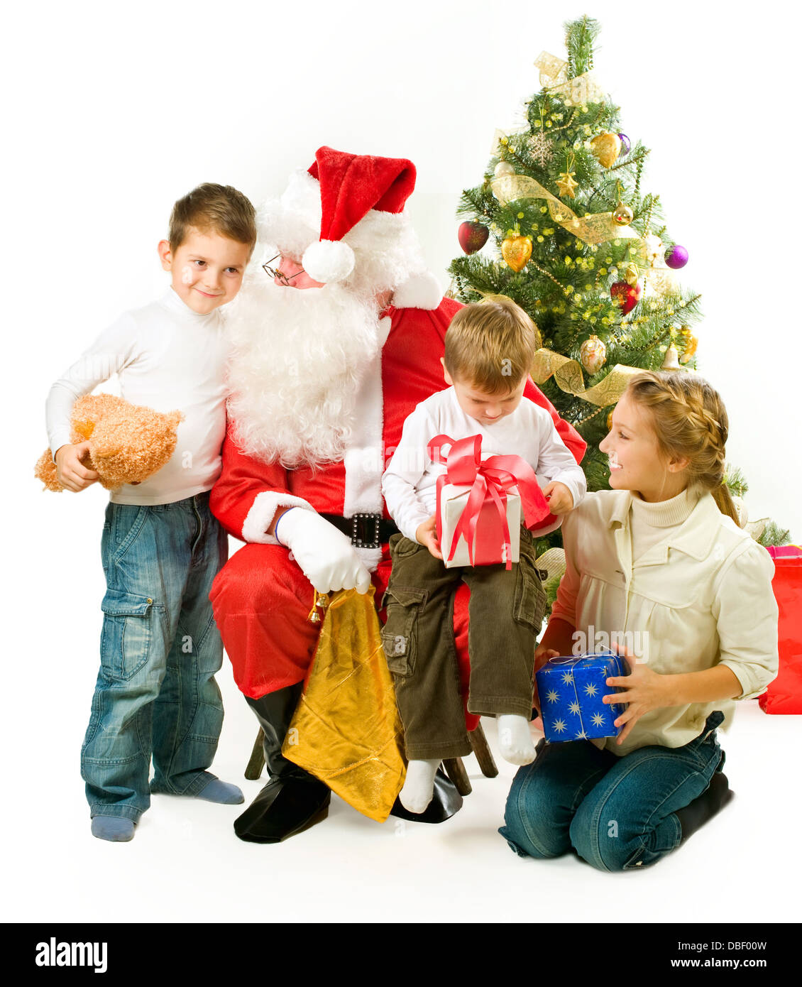 Santa Claus giving Christmas gifts to children Stock Photo - Alamy