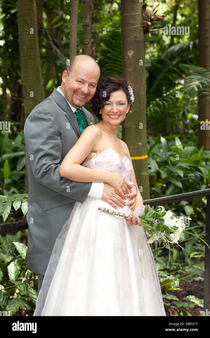 Hispanic newlywed couple smiling Stock Photo