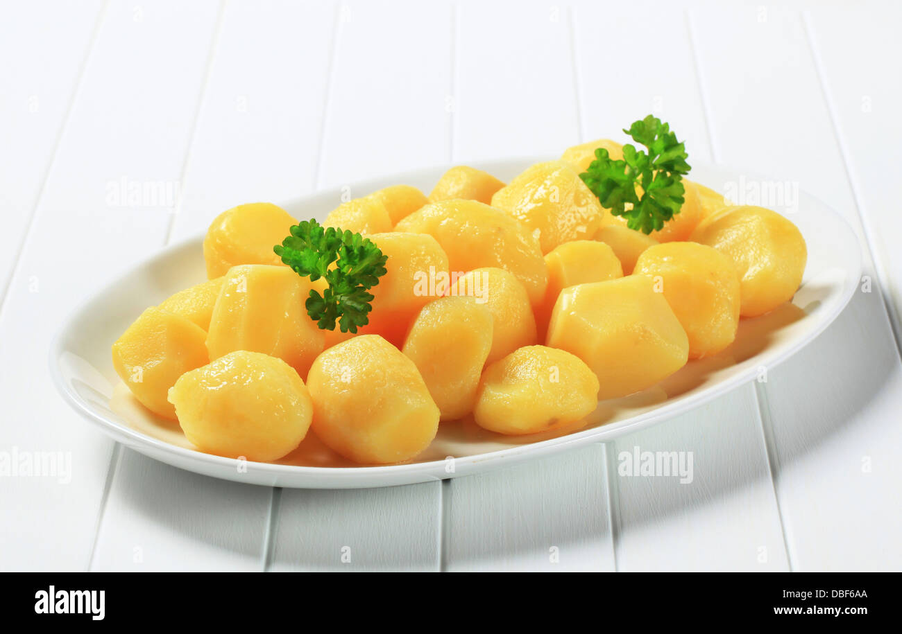 Boiled potatoes on oval plate Stock Photo