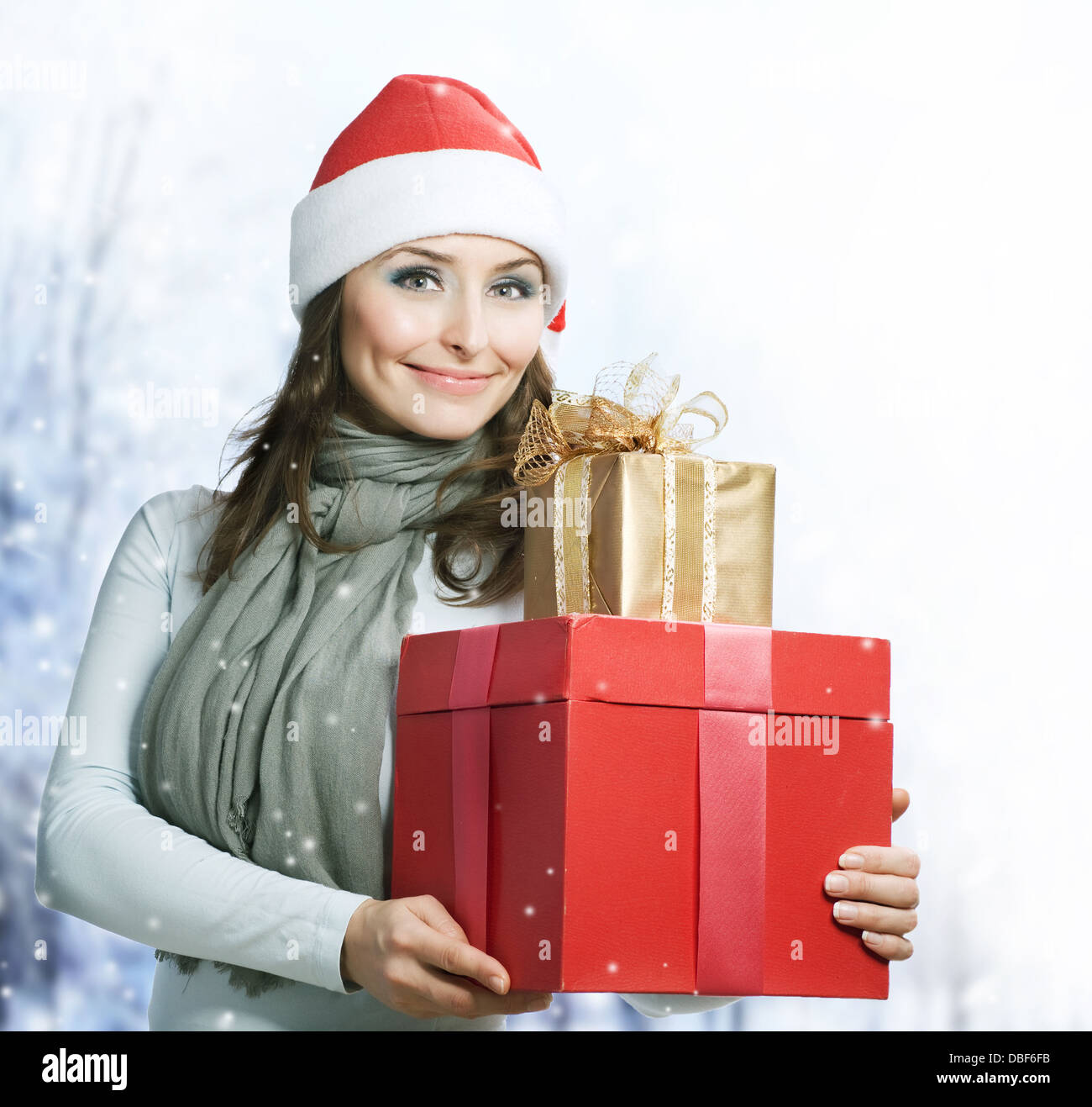 Santa Woman with Christmas Gift Box Stock Photo - Alamy