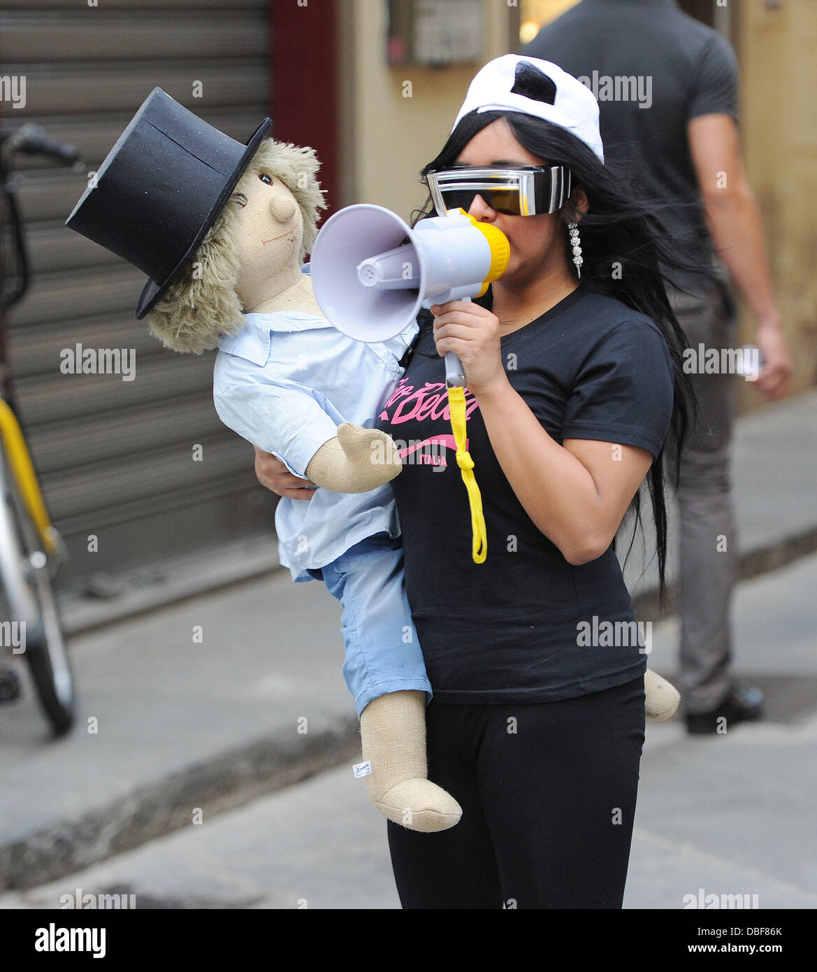 Nicole Snooki Polizzi cradles her baby doll, seen on location for News  Photo - Getty Images