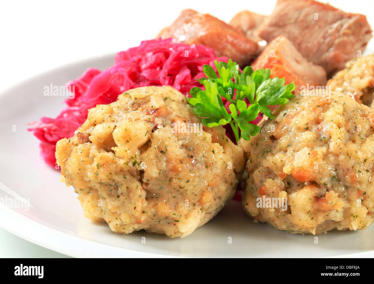 Dish of roast pork with Tyrolean dumplings and red kraut Stock Photo
