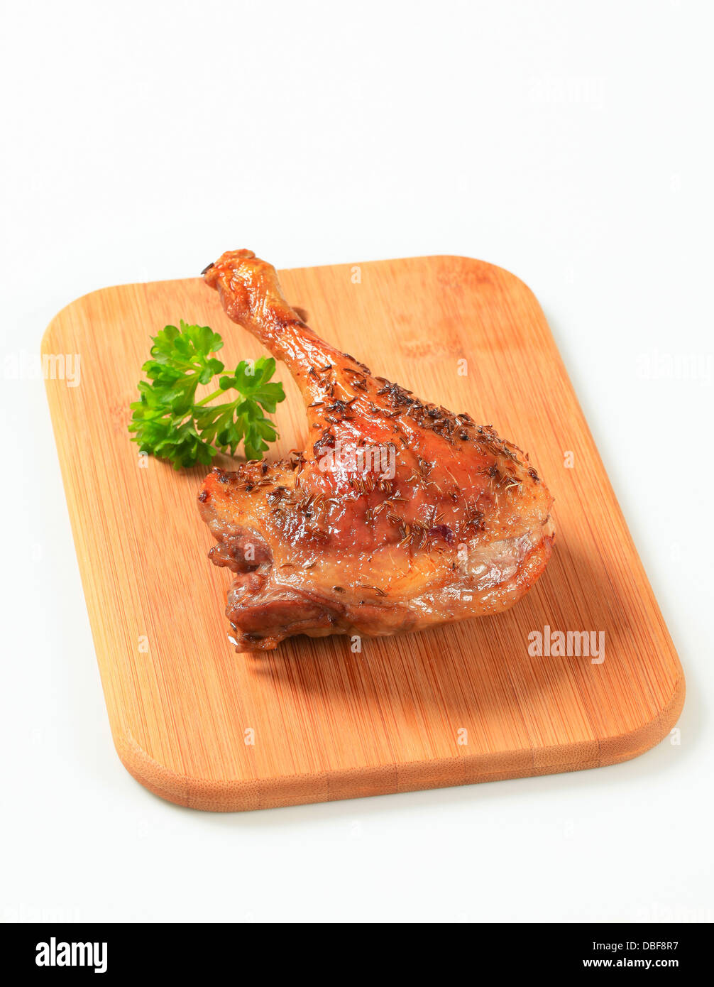 Roast duck leg topped with caraway seeds Stock Photo Alamy