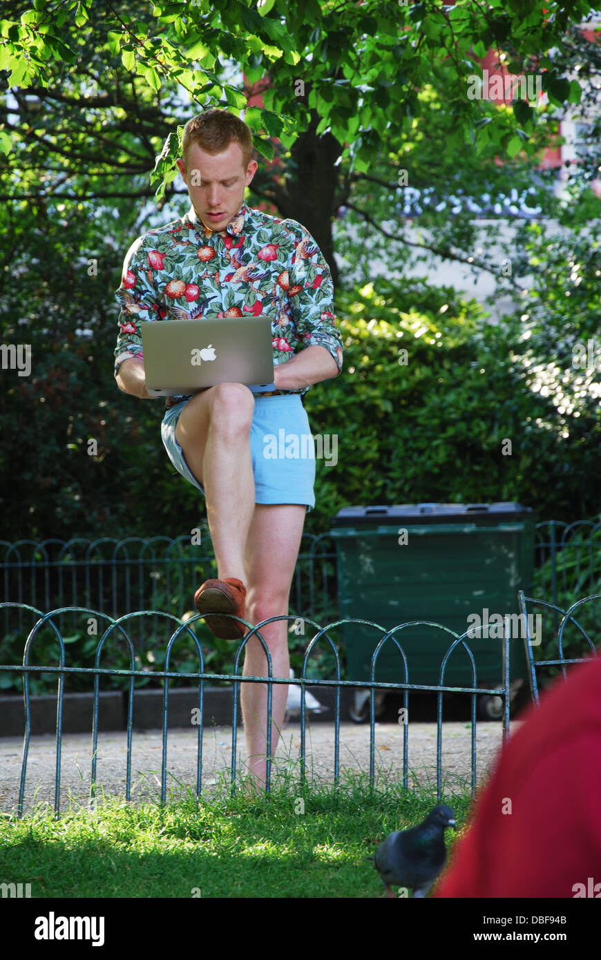 student working on his laptop outside, Brighton United Kingdom Stock