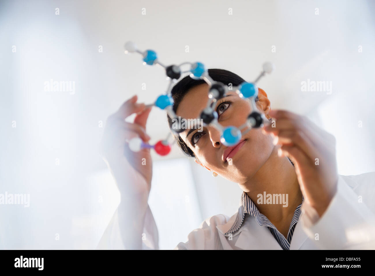 Indian scientist examining molecular model in lab Stock Photo - Alamy
