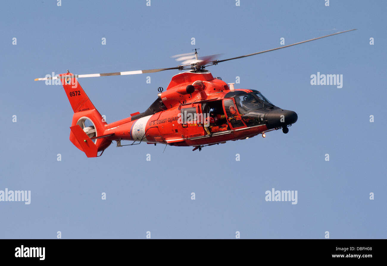 Coast Guard MH-65 Dolphin helicopter from Air Station Los Angeles conducts flight operations around the ports of Los Angeles and Stock Photo