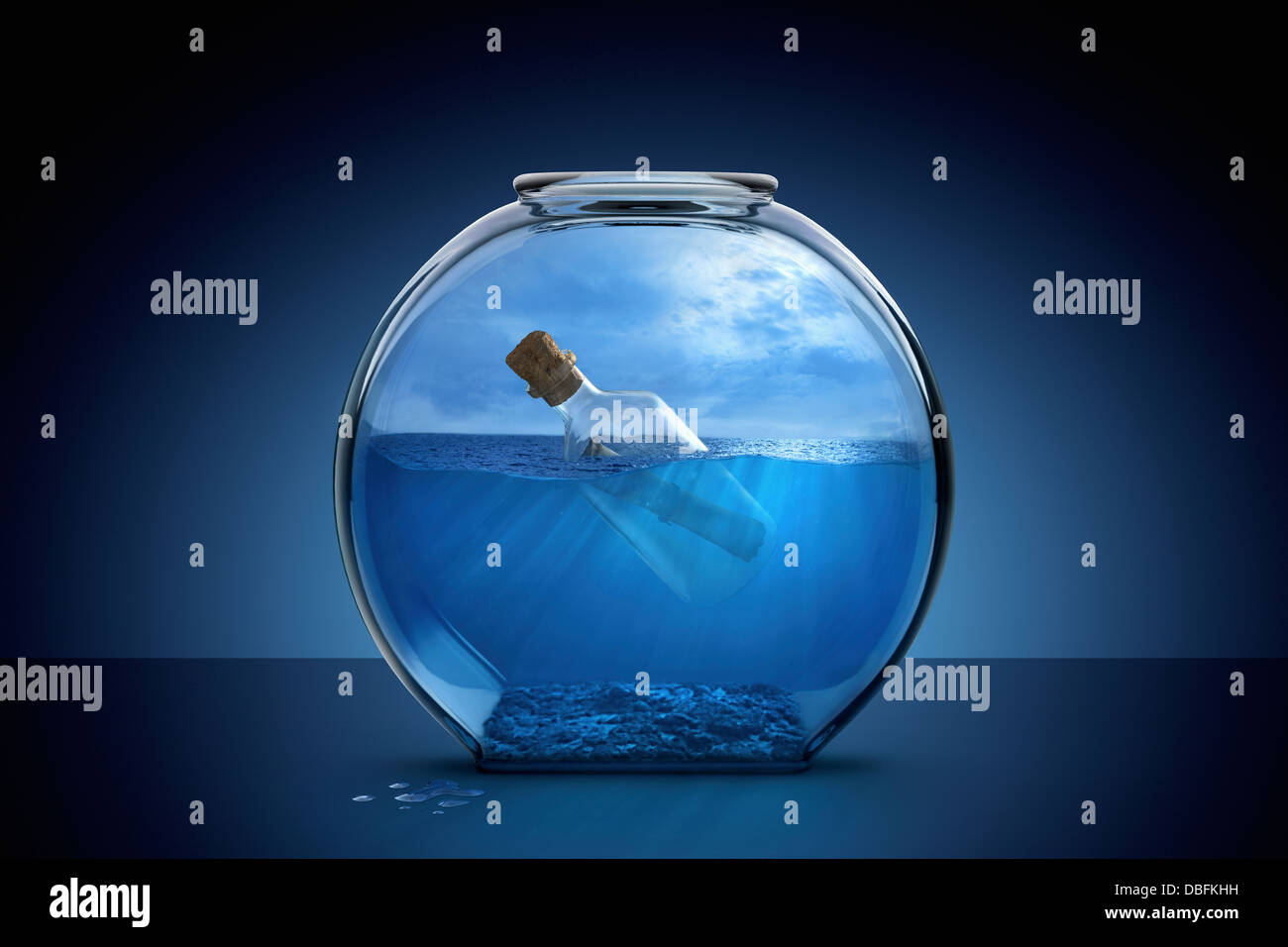 Message in a bottle in fishbowl Stock Photo