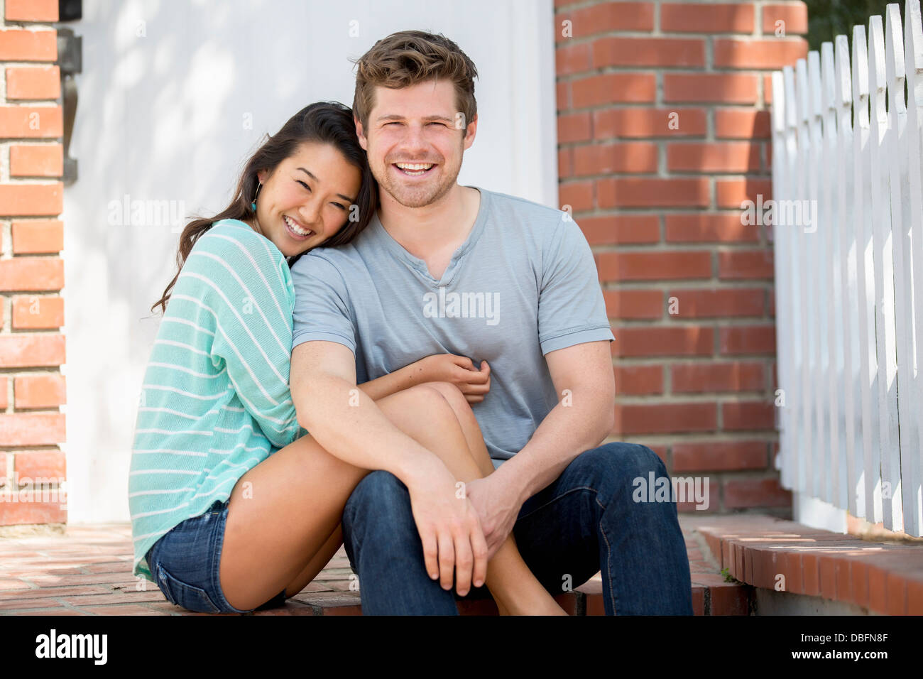 Couple smiling together outdoors Stock Photo