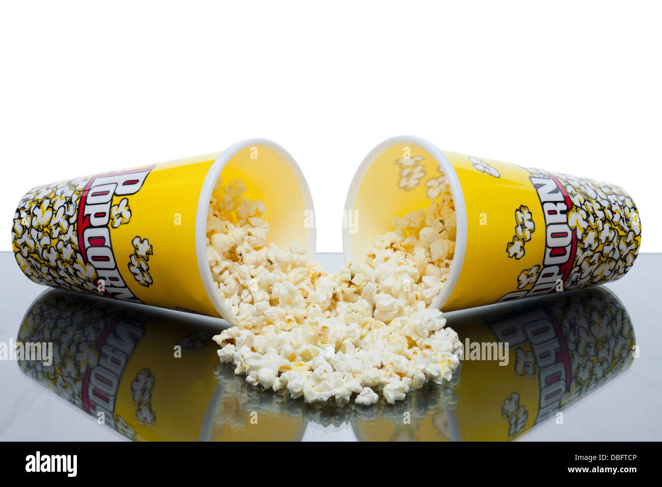 two cups of spilled popcorn Stock Photo
