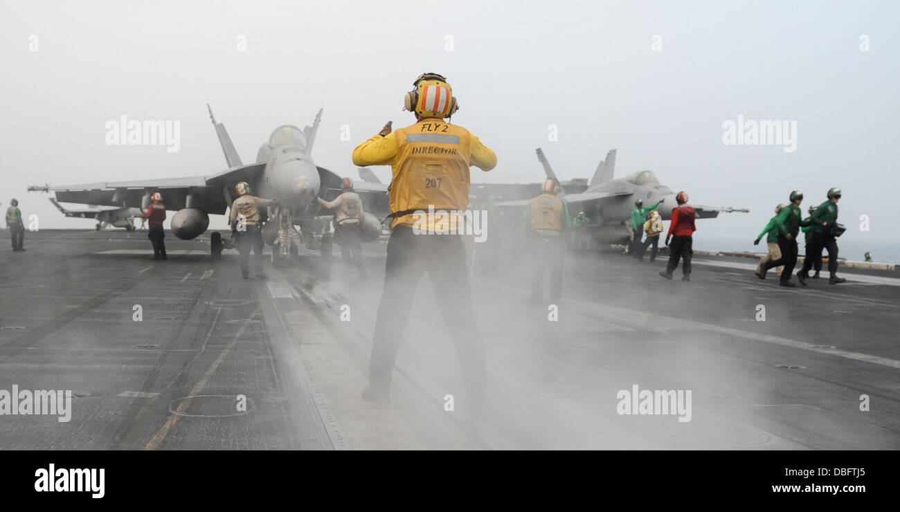 F/A-18F Super Hornet assigned to the Argonauts of Strike Fighter Squadron (VFA) 147 for launch on the flight deck of the aircraf Stock Photo