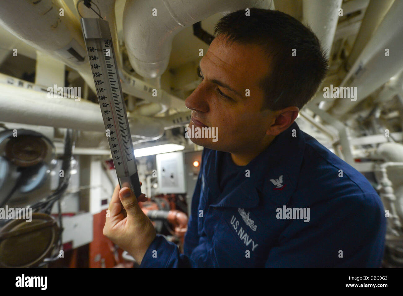 U.S. Navy Electronics Technician 3rd Class Jonathan Stremel checks the