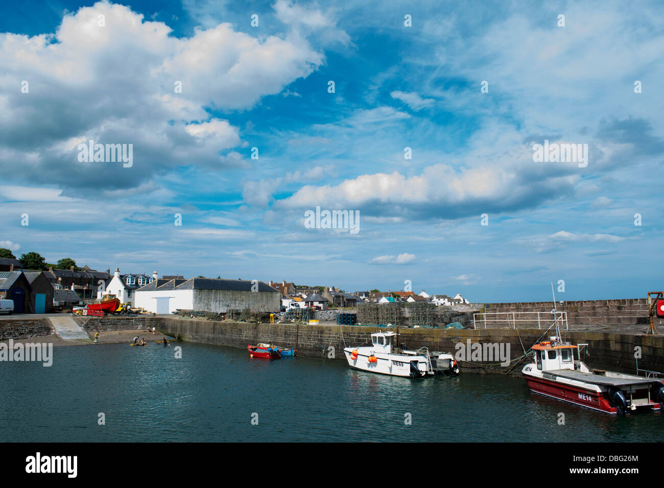 A colour image of boats in a harbour in a small fishing village Stock ...